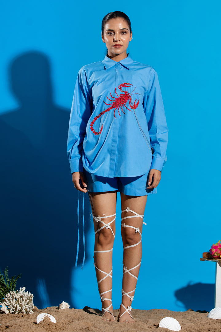 Blue shirt with red scorpion embroidery
