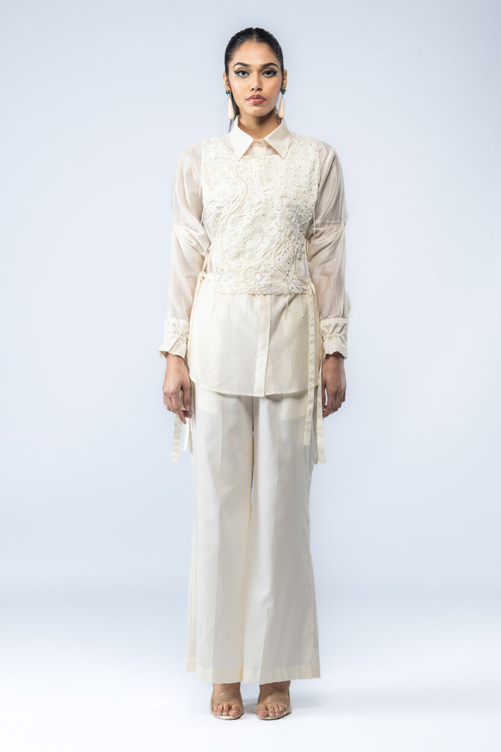 A Chanderi silk shirt and bell pants, paired with a hand-embroidered bib - Ivory