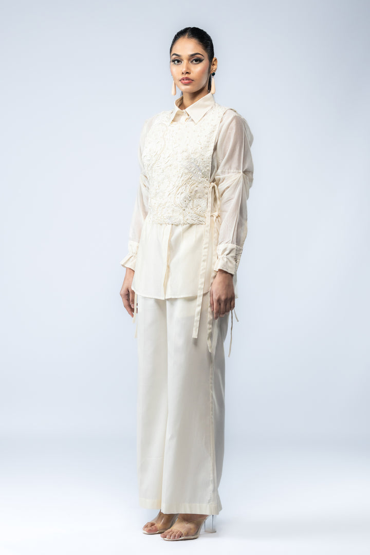 A Chanderi silk shirt and bell pants, paired with a hand-embroidered bib - Ivory