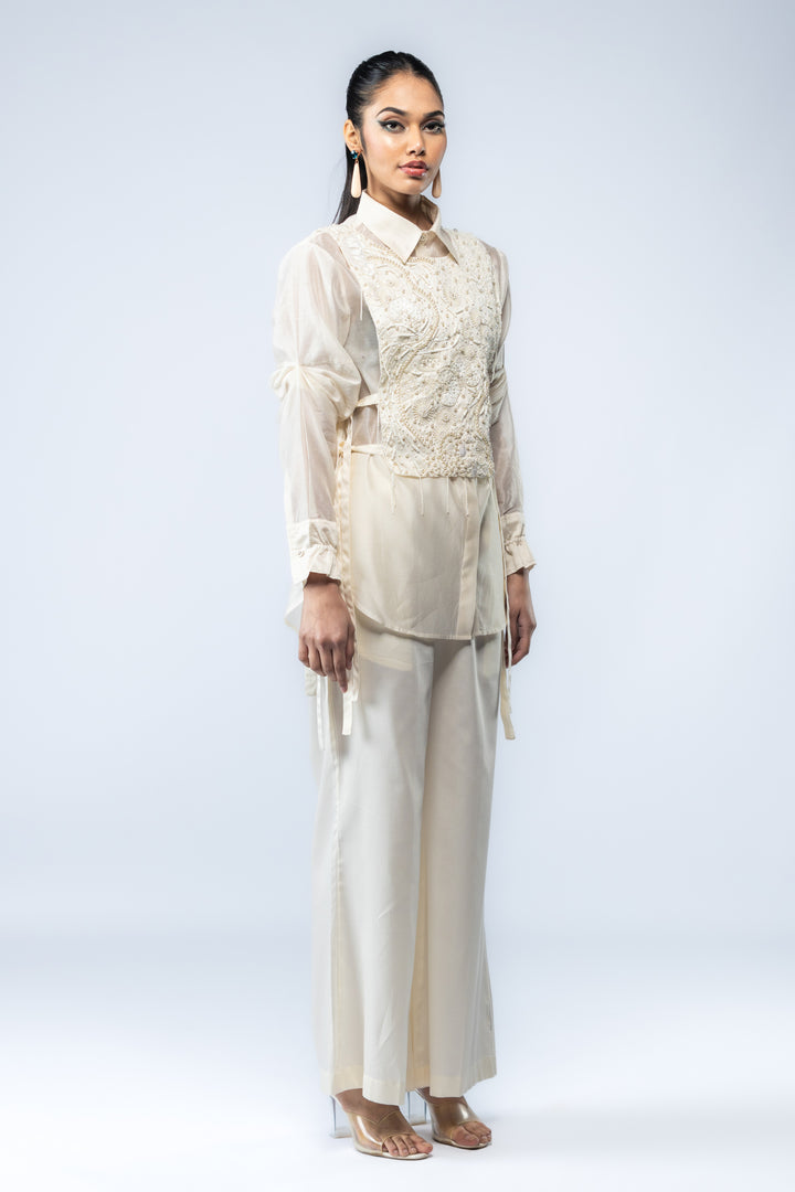 A Chanderi silk shirt and bell pants, paired with a hand-embroidered bib - Ivory