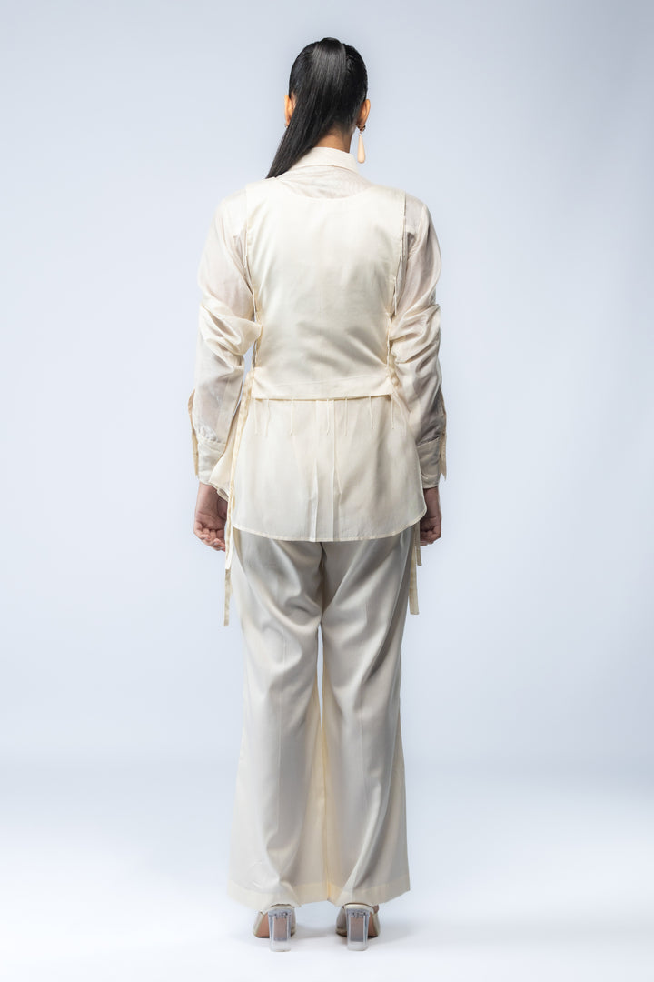 A Chanderi silk shirt and bell pants, paired with a hand-embroidered bib - Ivory