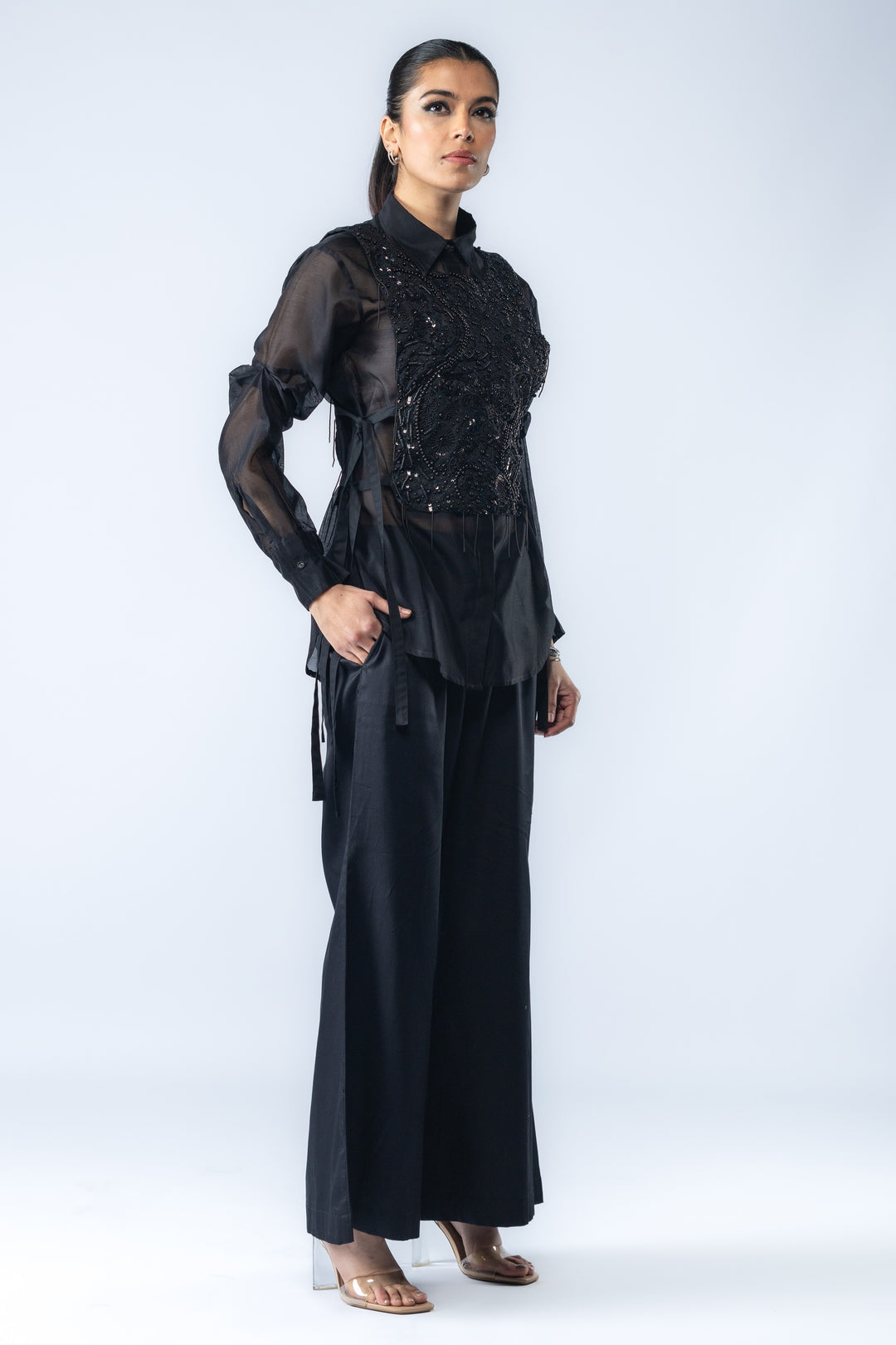 A Chanderi silk shirt and bell pants, paired with a hand-embroidered bib - Black