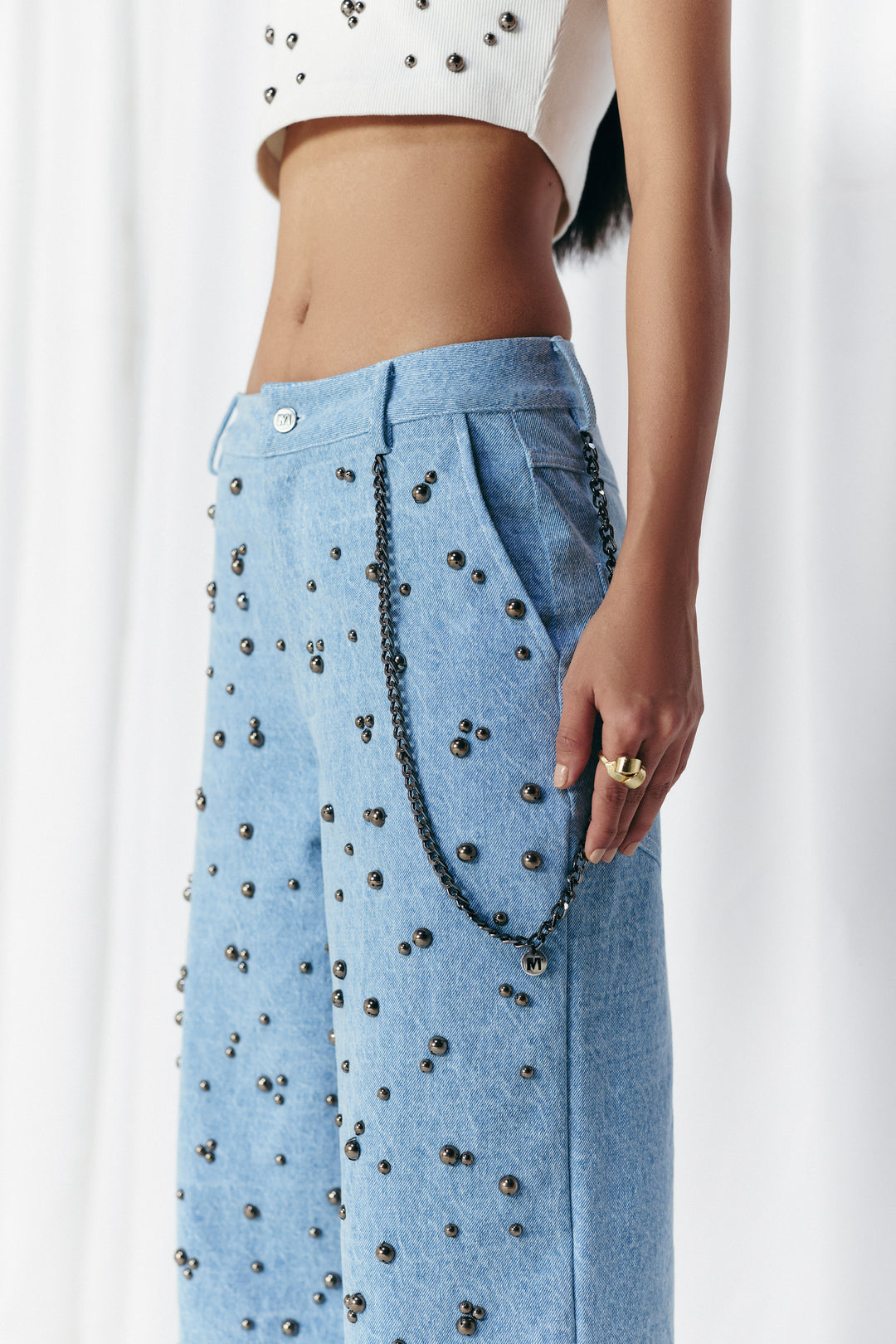 WASHED DENIM STUDDED JEANS